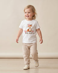 Child wearing a 'Big Sister' t-shirt with a fox design on a plain background