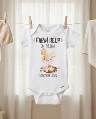 Baby onesie with pig illustration and text on a clothesline