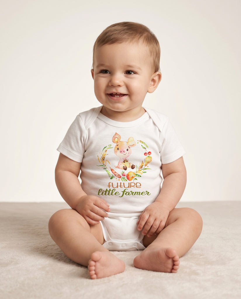 Baby wearing a 'Future Little Farmer' onesie on a light background