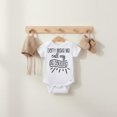 "Don't make me call my big cousins!" with adorable hand written type accents.  This design is great for all girls and boys!  This shirt or bodysuit (or organic onesie®) is great to use a pregnancy reveal and to send to family as a surprise baby announcement gift!  They will love to receive this as a gift!  So cute and it's sure to bring lots of smiles! Makes a great baby shower gift!