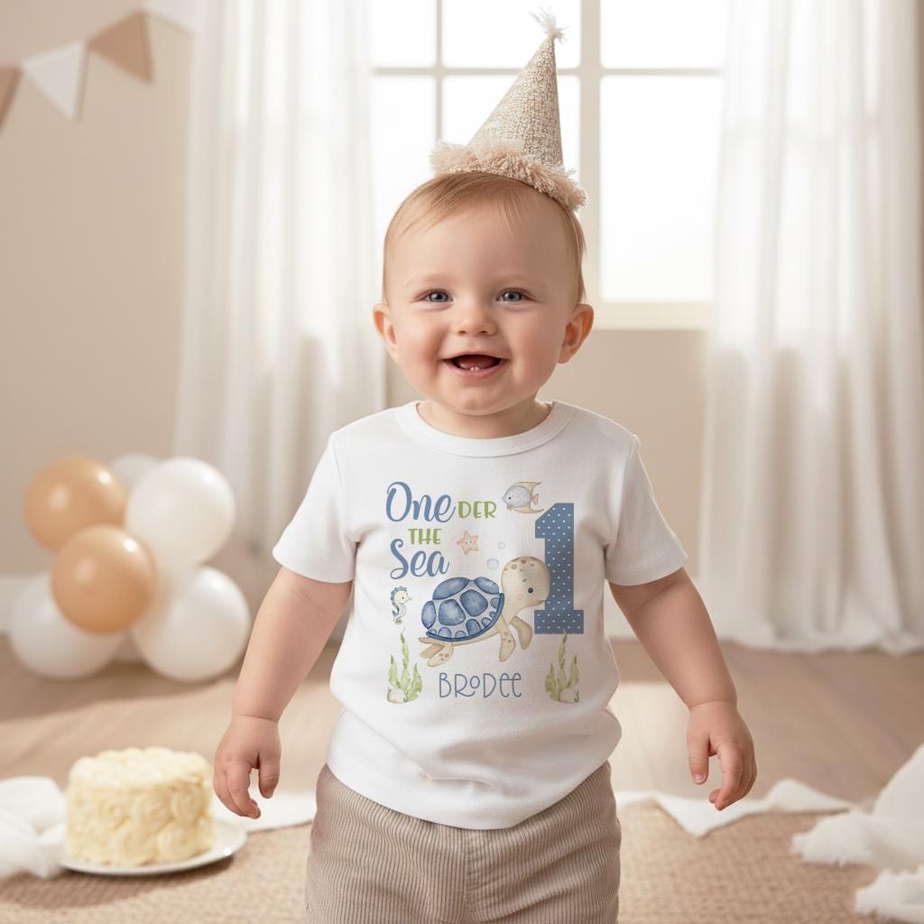 Under the Sea theme First Birthday Onesie®.  Such a CUTE first birthday bodysuit or t-shirt for your little one!  It features a variety of watercolor sea creatures and your little one's name.  Adorable One der the sea theme!