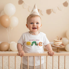"Hungry Little One "  Celebrate your little one's first birthday with this cute caterpillar-themed onesie. Perfect for a day full of colorful fun, this design will make your baby the most charming little crawler at the party!