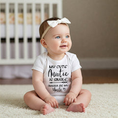 May include: A white short-sleeved baby bodysuit featuring black text that reads My Cute Auntie Is Single (Wanna Be My Uncle?) with an arrow graphic. The garment is paired with a simple white bow headband, creating a clean and coordinated look.