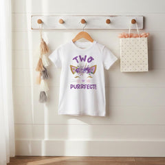 Celebrate your little girl's second birthday party in style with our "Two Purrfect" kids tee! It's the purr-fect choice for the occasion, featuring an utterly adorable kitten face and the oh-so-purrfect phrase that'll make her giggle with delight. Whether she's twirling with excitement or enjoying a slice of cake, this tee will keep her comfy and cute throughout her special day. with "Two Purrfect," your birthday girl is sure to spread twice the joy and feline
