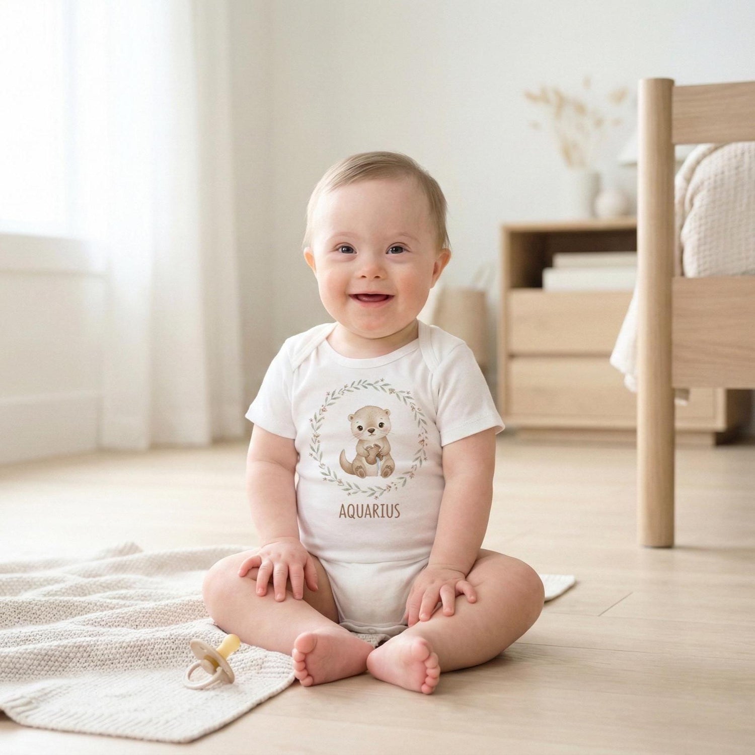 Aquarius zodiac baby onesie featuring a soft neutral boho watercolor design on a bright white background. Unisex astrology baby outfit perfect for January and February birthdays, newborn photos, baby shower gifts, and horoscope-themed milestone pictures. High-quality printable zodiac artwork for infant clothing and personalized baby gifts.