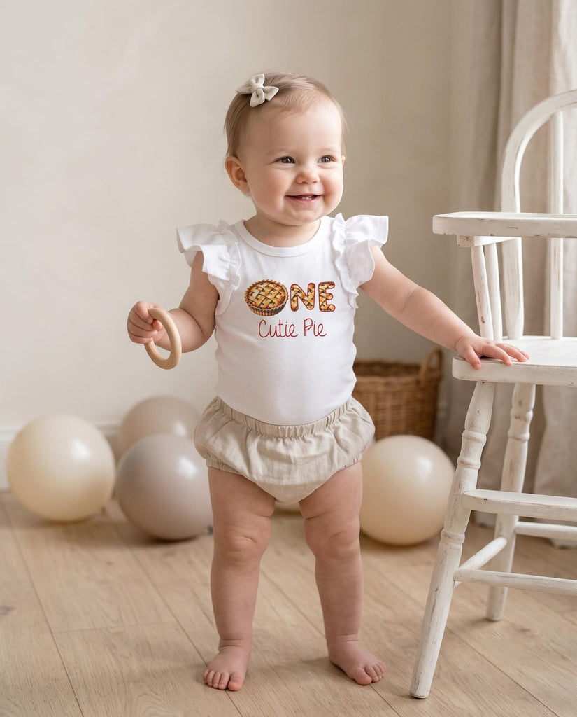 one cutie pie fall birthday outfit for cake smash sessions for a first birthday girl