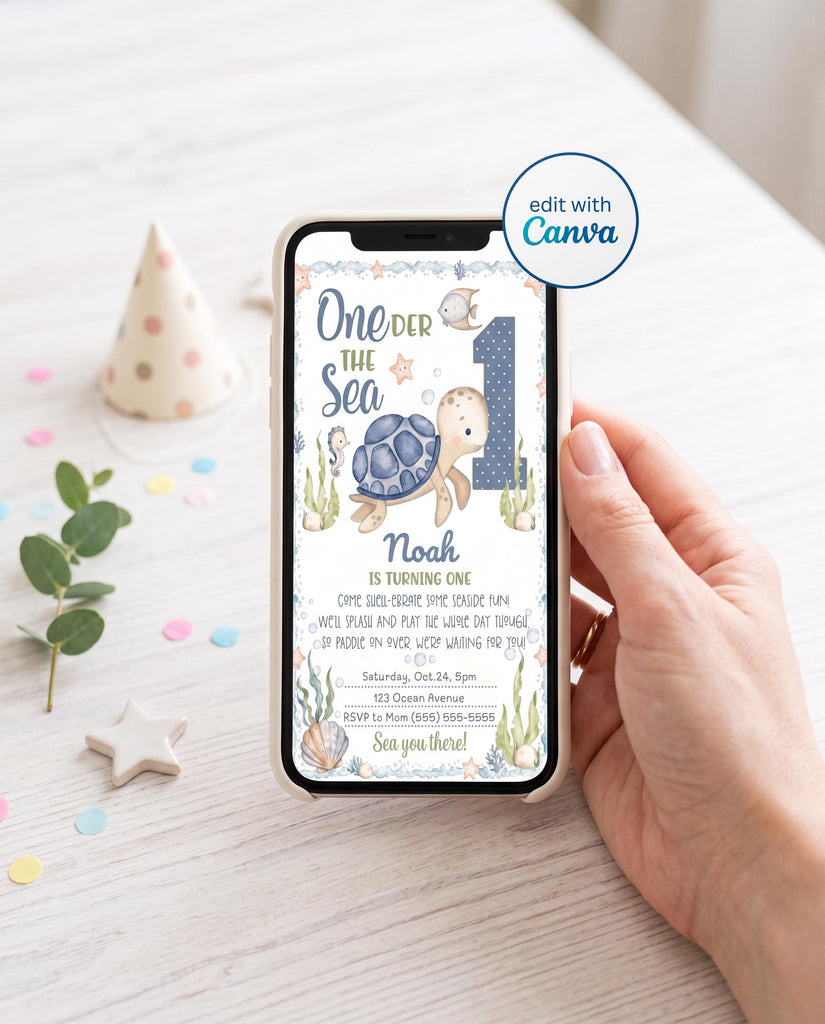 Hand holding a smartphone showing the phone version of an editable One-der the Sea turtle 1st birthday invitation with a watercolor sea turtle, polka dot number 1, and ocean creatures, next to a polka dot party hat, confetti, and eucalyptus, with an edit with Canva badge.